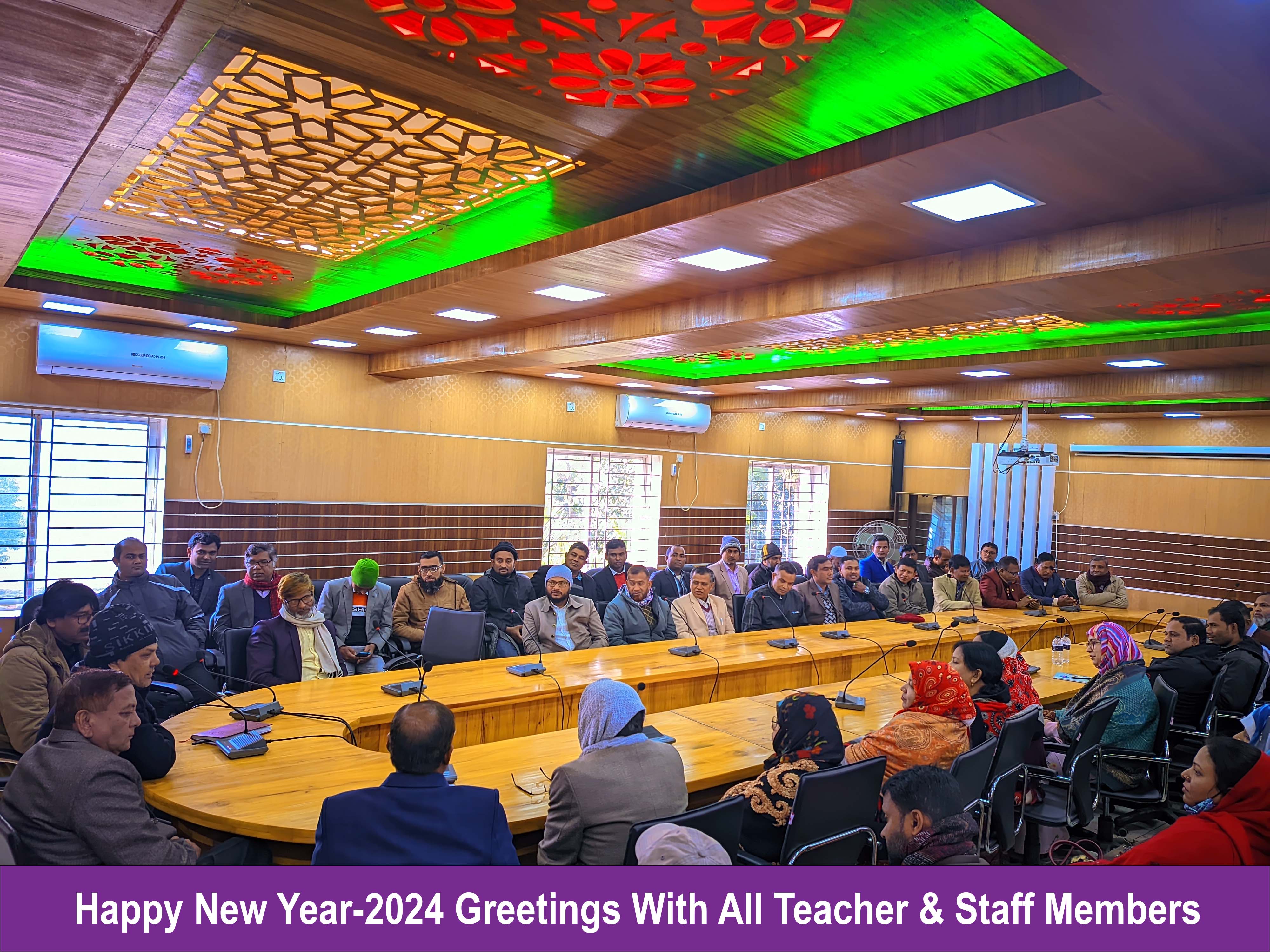 English Happy New Year-2024 in Uttar Bangla College, the principal exchanged greetings with all the teachers and employees. Md. Abdur Rauf Sarkar.